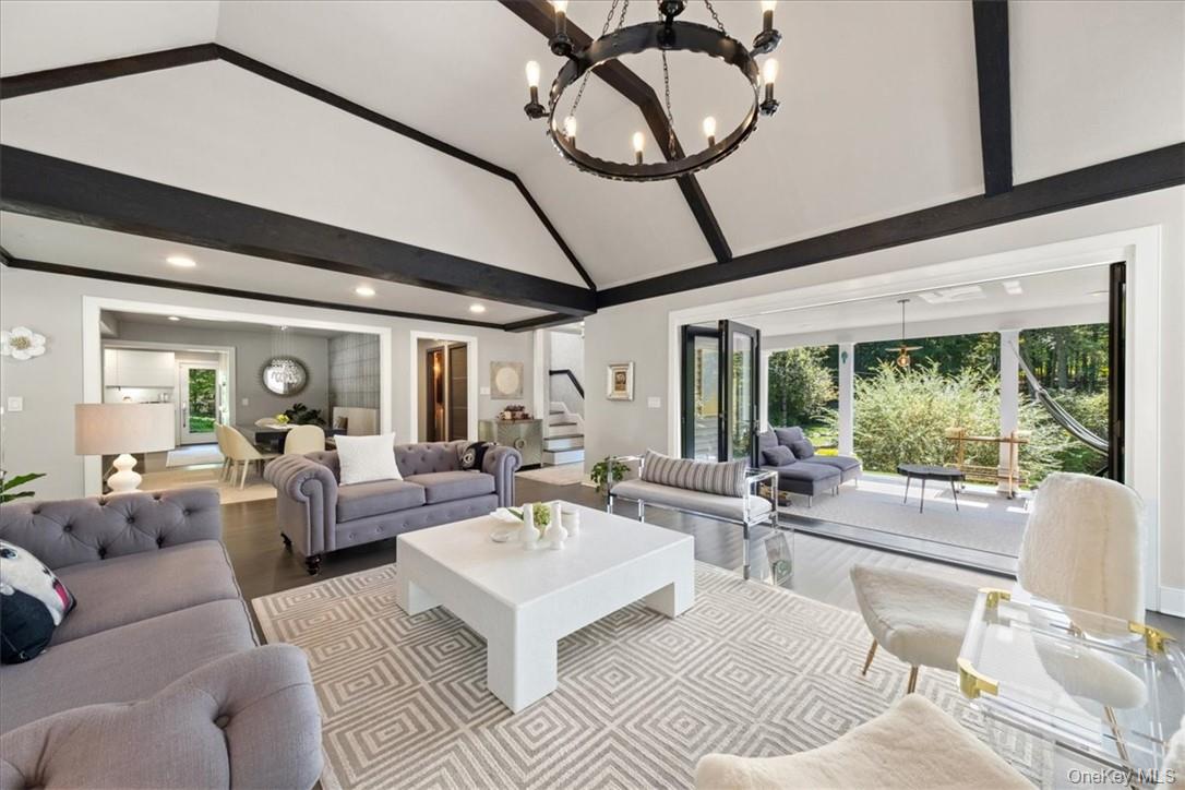 1570 Journeys End Road Croton-on-Hudson, NY 10520 - Photo 9 of 50 a living room with furniture and a large window