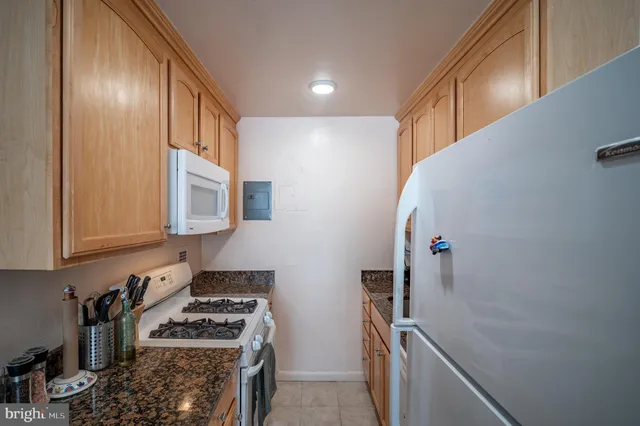 a living room with furniture a rug and a window