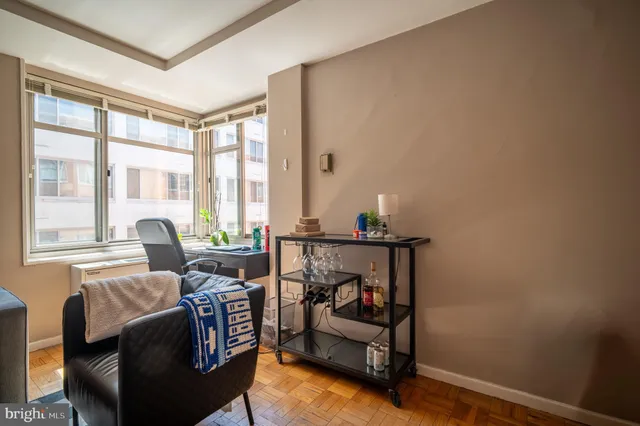 a living room with furniture and a rug
