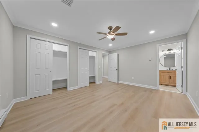 a view of an empty room with a bathroom