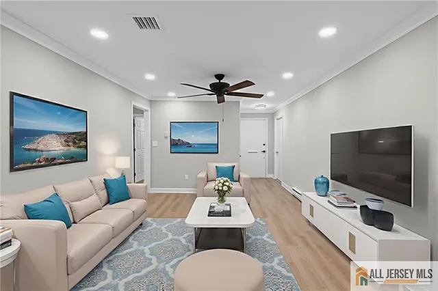 a living room with furniture and a flat screen tv