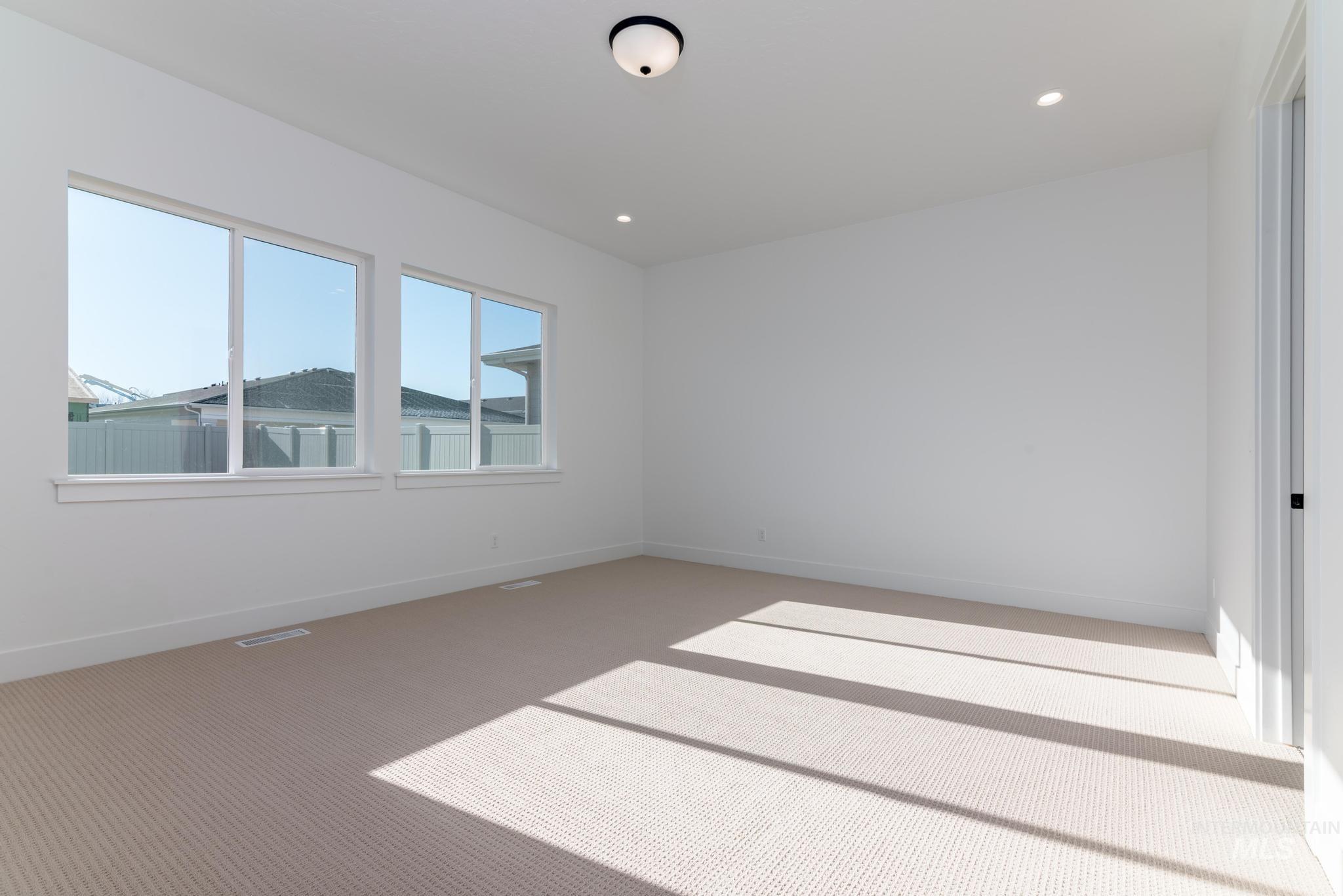 9085 West Patmore Court Star, ID 83669 - Photo 18 of 40 Carpeted empty room featuring baseboards and recessed lighting