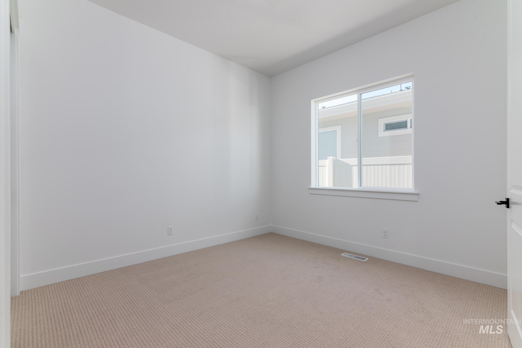 9085 West Patmore Court Star, ID 83669 - Photo 22 of 40 Spare room featuring carpet floors and baseboards