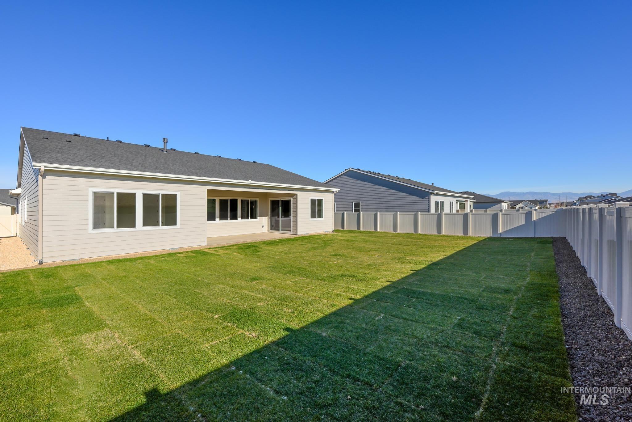 9085 West Patmore Court Star, ID 83669 - Photo 28 of 40 Rear view of property featuring a patio and a fenced backyard