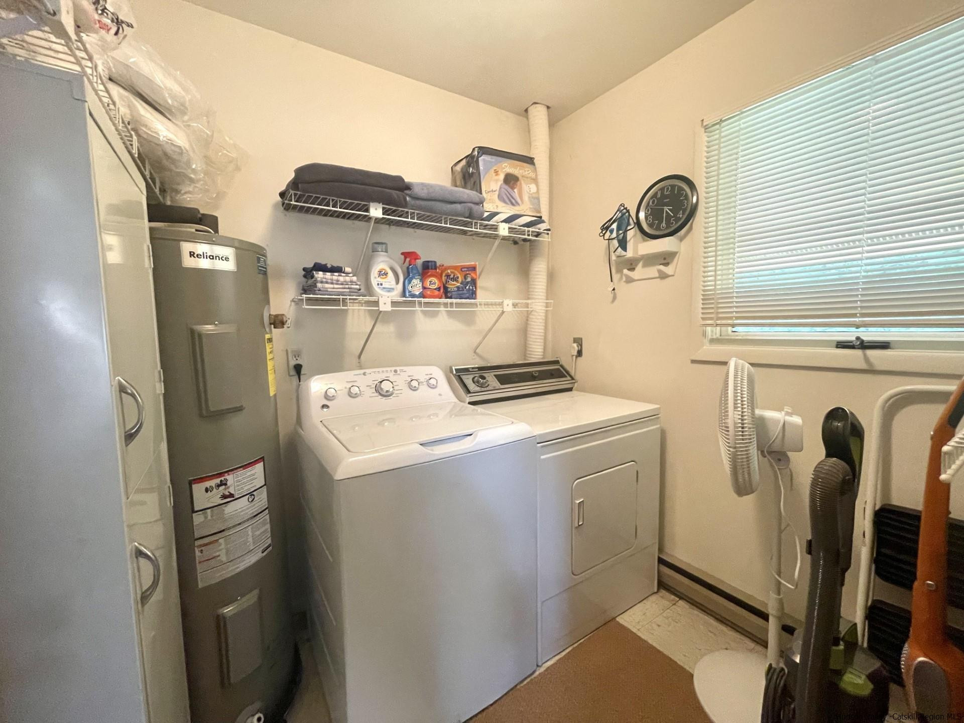 72 Hunter Ridge, Unit L1 Hunter, NY 12442 - Photo 19 of 23 a utility room with dryer and washer