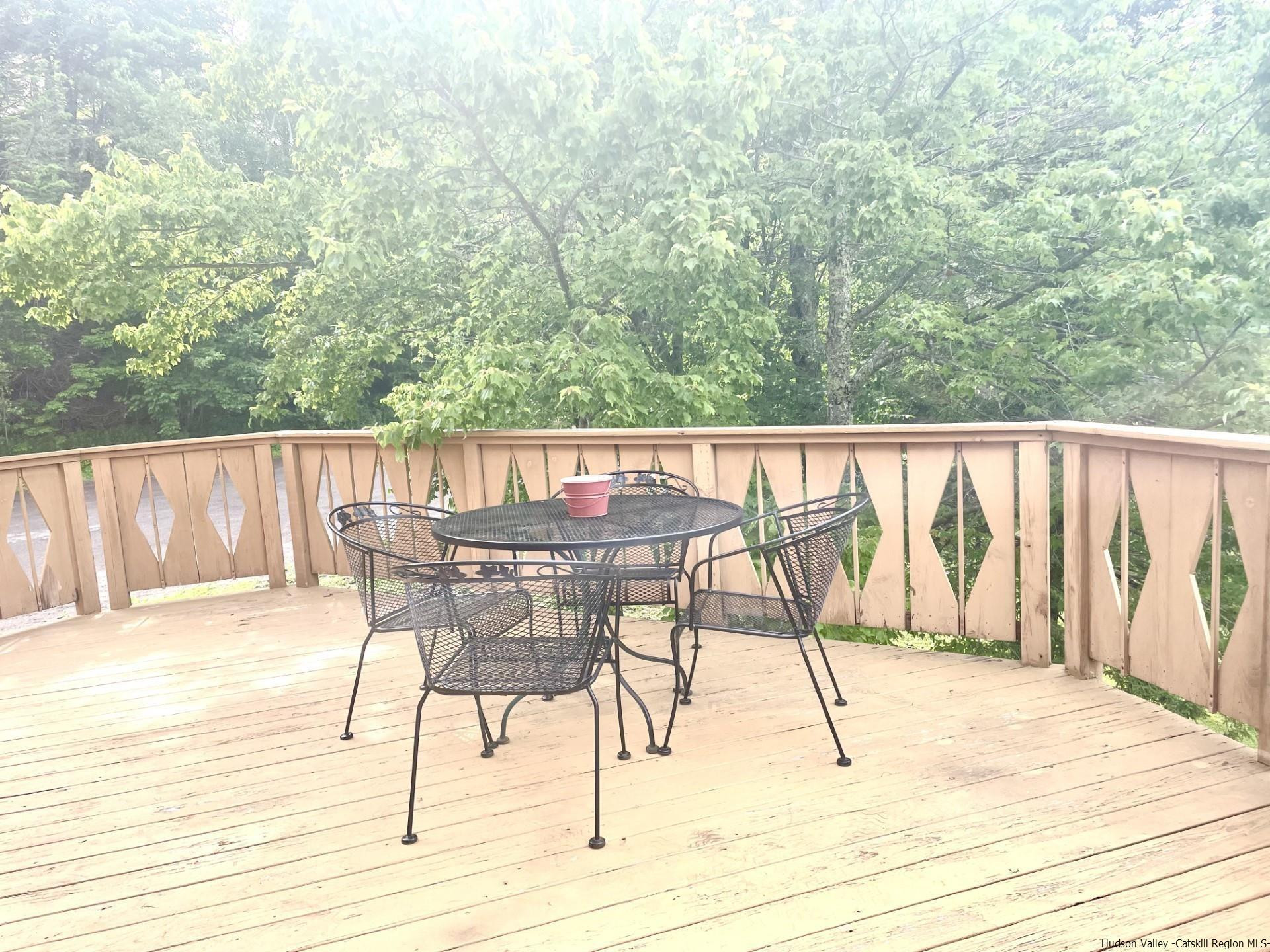 72 Hunter Ridge, Unit L1 Hunter, NY 12442 - Photo 20 of 23 a view of wooden floor with a table and chairs