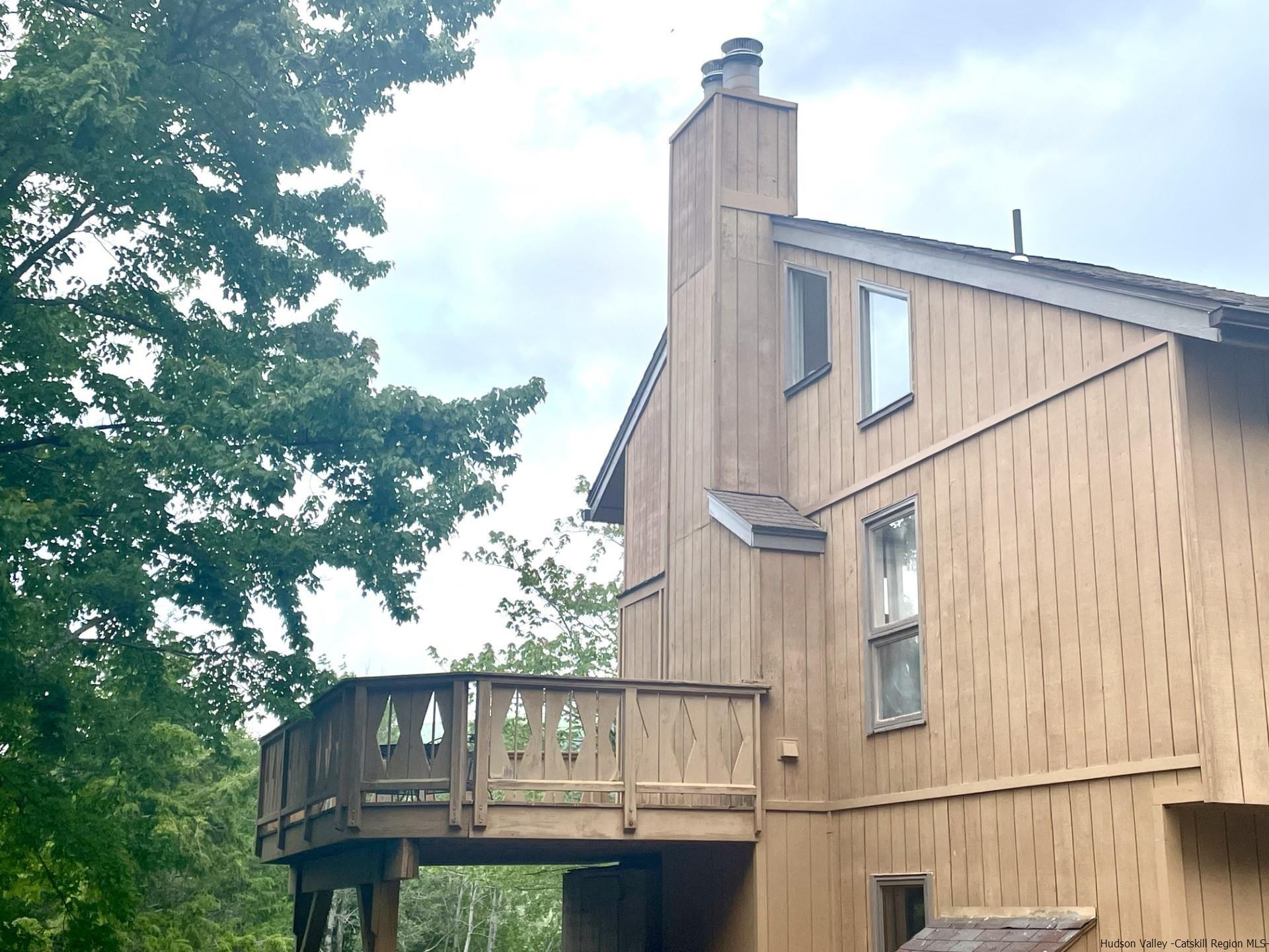 72 Hunter Ridge, Unit L1 Hunter, NY 12442 - Photo 22 of 23 a view of a house with a tree