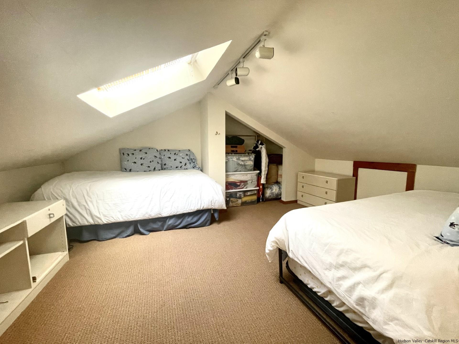 72 Hunter Ridge, Unit L1 Hunter, NY 12442 - Photo 6 of 23 a bedroom with a bed and window