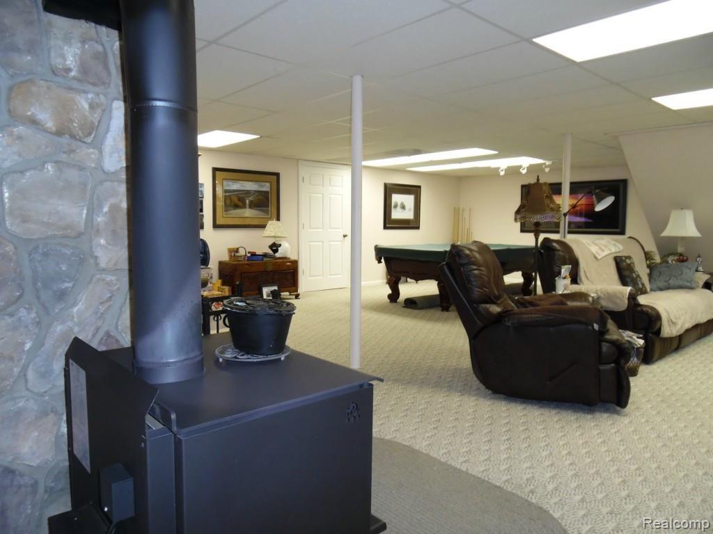 3885 South Lake George Road Dryden, MI 48428 - Photo 19 of 22 Wood Burner
