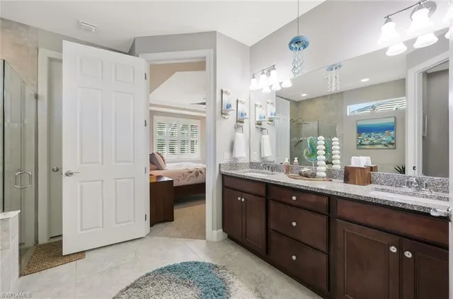 a spacious bathroom with a granite countertop sink mirror and a