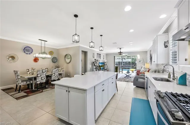 a large white kitchen with lots of counter space