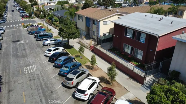 an aerial view of a house with swimming pool and lounge chairs
