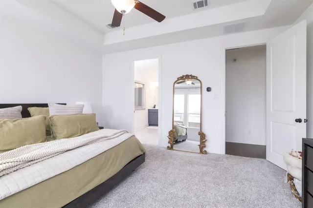 a living room with a bed furniture and a large window