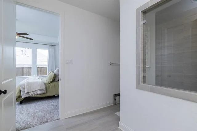 a room that has a bed and a window