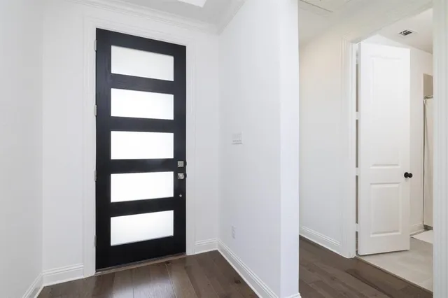 a view of front door with wooden floor