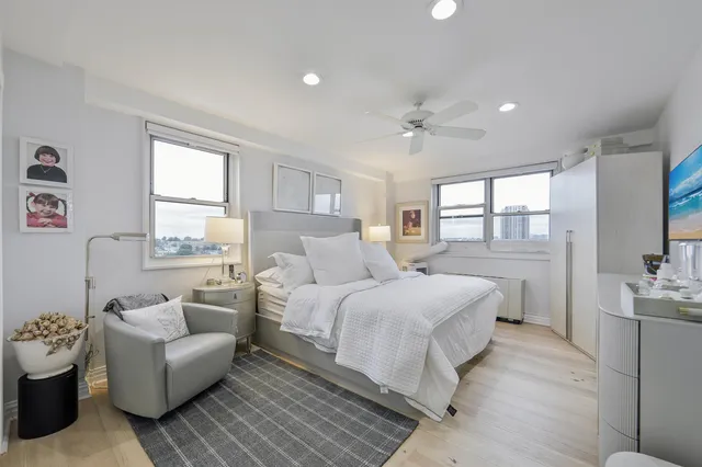 a bedroom with a bed and a couch