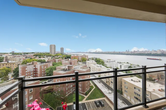 a view of a balcony and city view