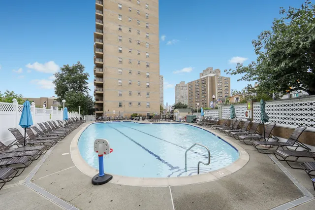 a view of outdoor space with swimming pool and patio