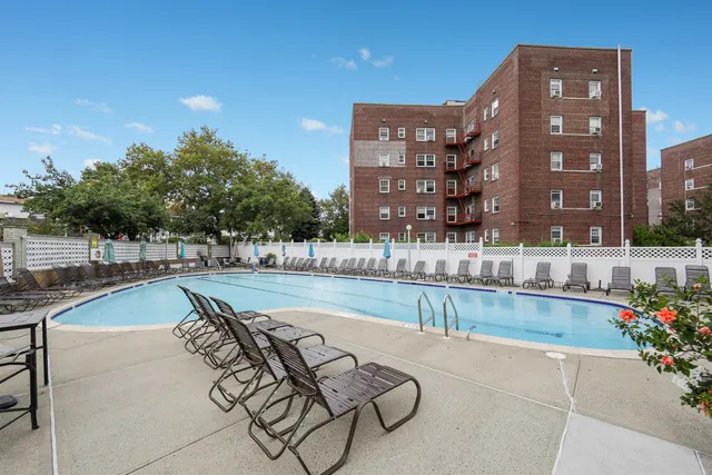 a view of a swimming pool with a patio