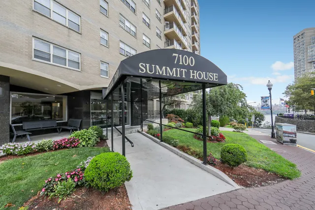 a view of a chairs and table in patio with a fire pit