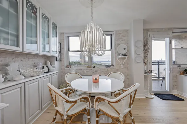 a dining room with furniture and window