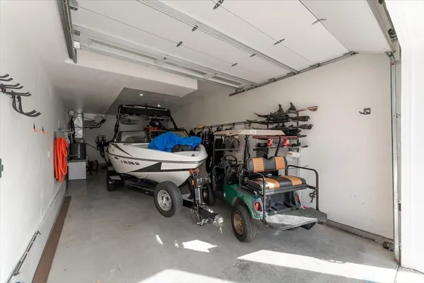a storage room with water heater and racks