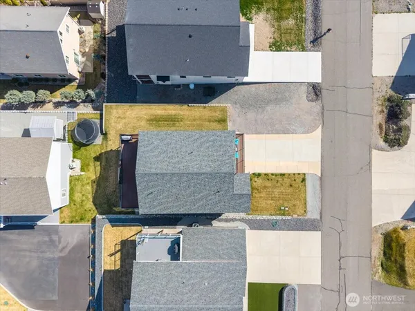 an aerial view of residential houses with outdoor space