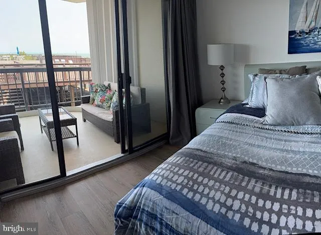 a bedroom with a bed and large window