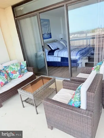 view of living room with furniture and flowers