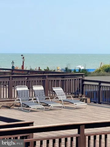a view of swimming pool next to a yard
