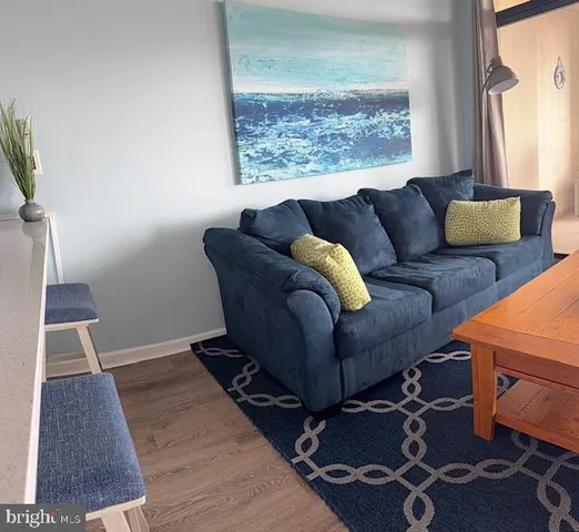 a living room with furniture and a window