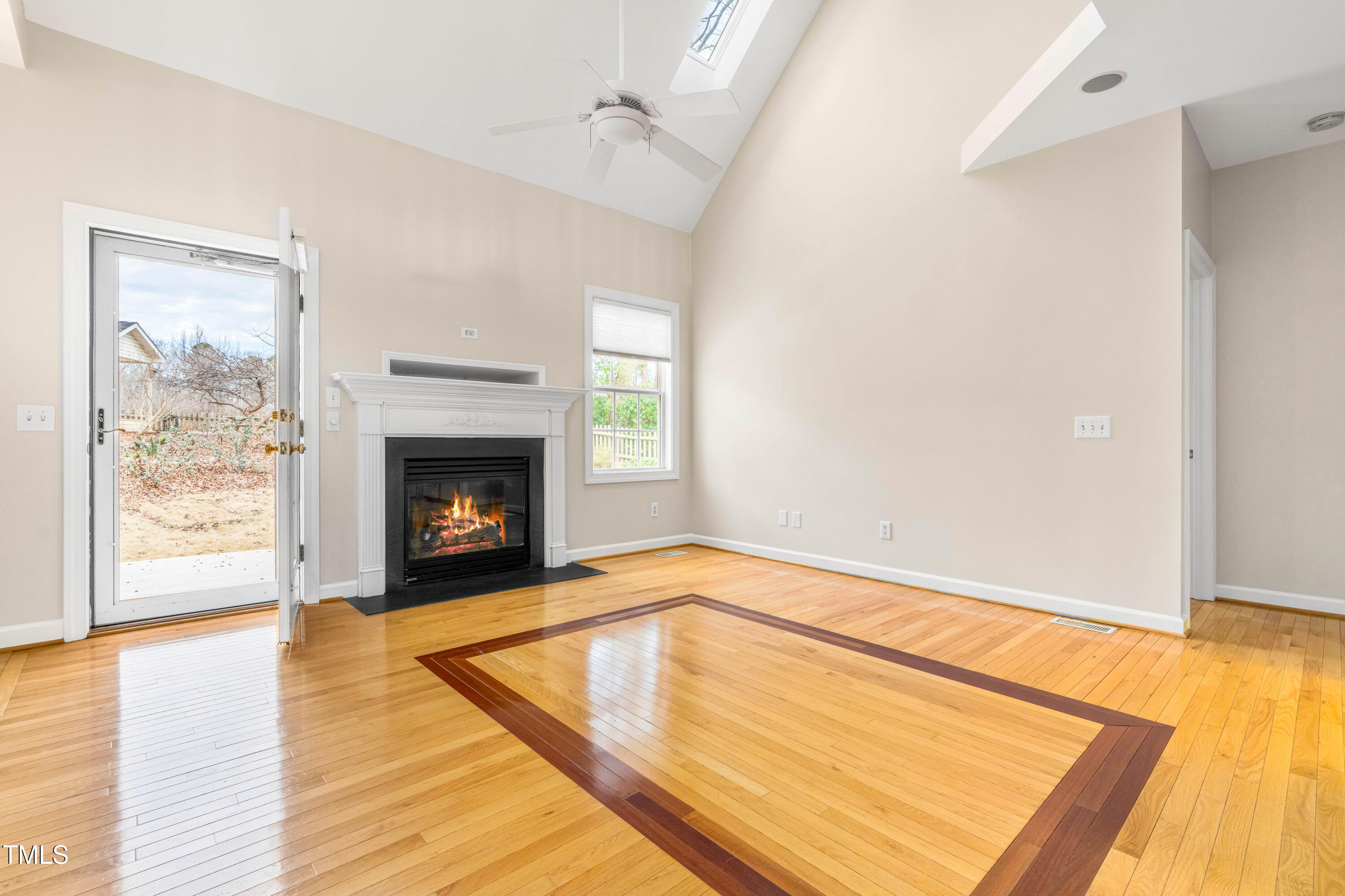 6328 Nowell Pointe Drive Raleigh, NC 27607 - Photo 23 of 56 Living Room with Fireplace and Open Back