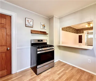 a kitchen with stainless steel appliances granite countertop a stove and a refrigerator