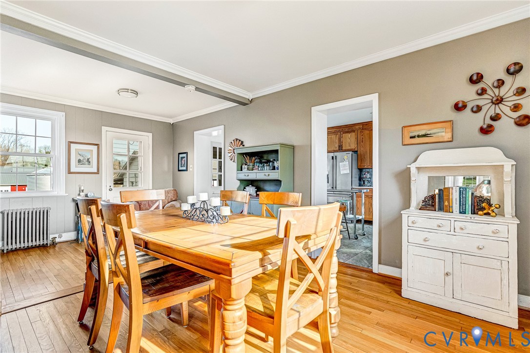 2172 Piping Tree Ferry Road Mechanicsville, VA 23111 - Photo 15 of 50 a view of a dining room with furniture and wooden floor
