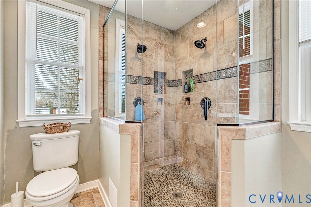 2172 Piping Tree Ferry Road Mechanicsville, VA 23111 - Photo 20 of 50 a white toilet sitting next to a bathroom sink