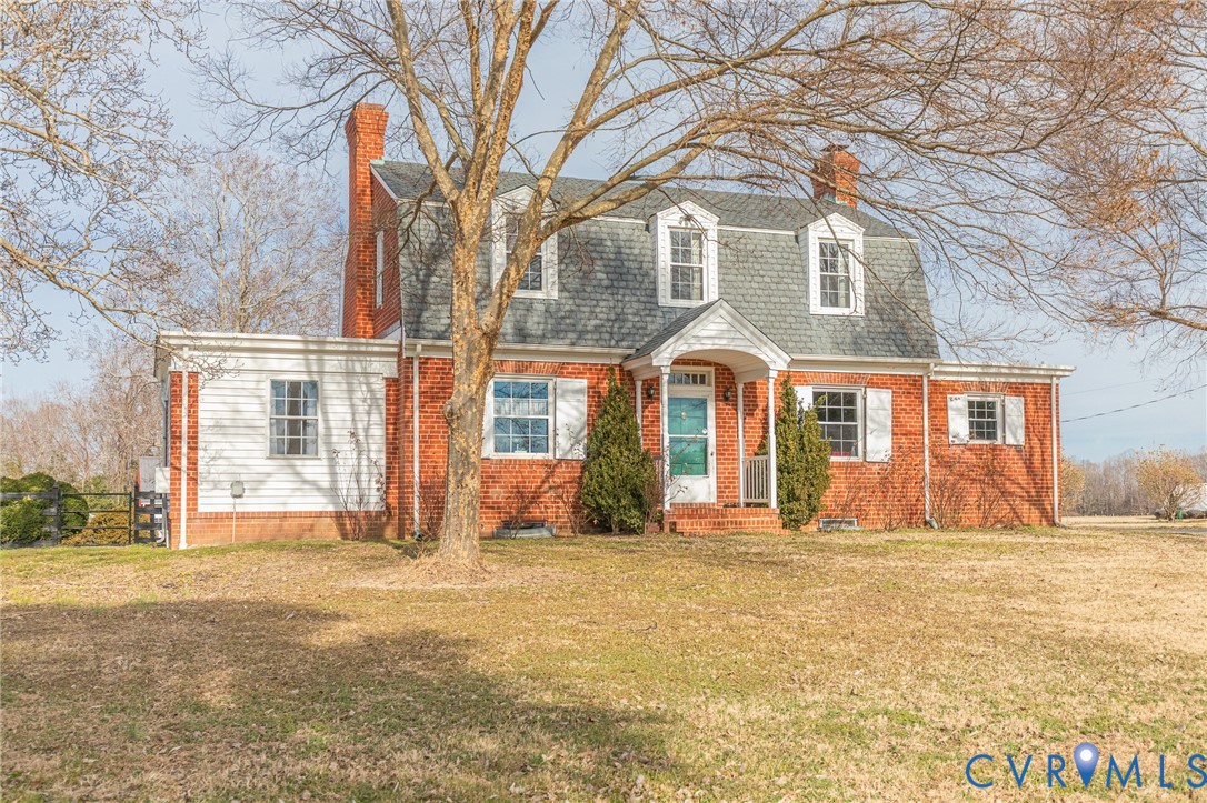 2172 Piping Tree Ferry Road Mechanicsville, VA 23111 - Photo 2 of 50 a view of a brick house with a large trees