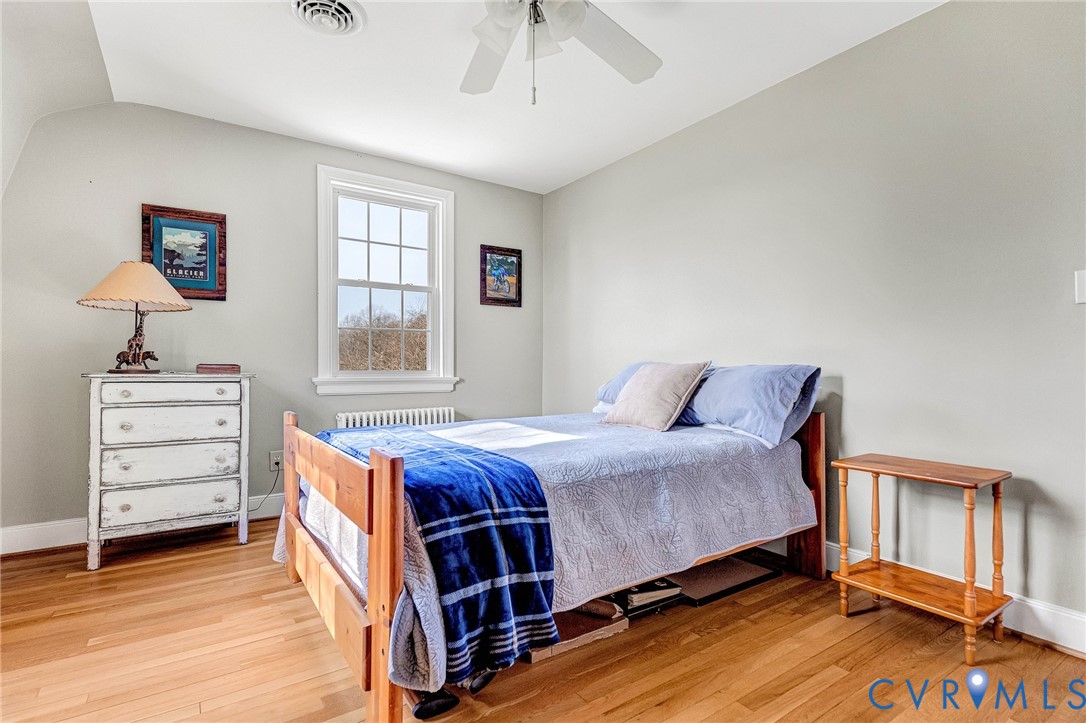 2172 Piping Tree Ferry Road Mechanicsville, VA 23111 - Photo 25 of 50 a bedroom with a bed and a dresser