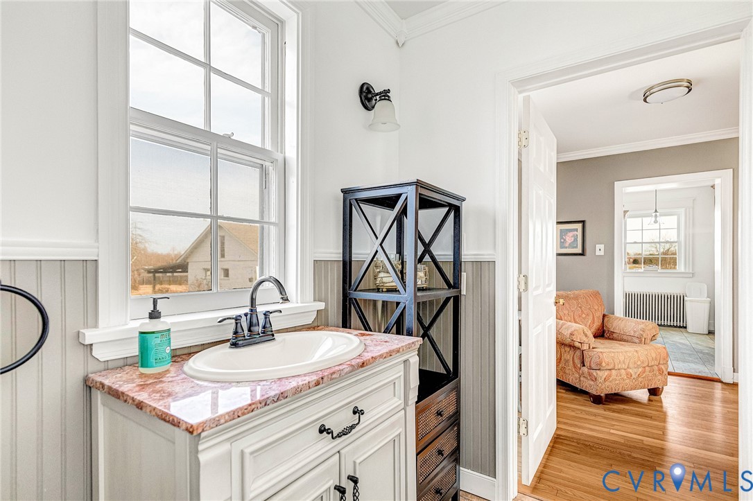 2172 Piping Tree Ferry Road Mechanicsville, VA 23111 - Photo 27 of 50 a en suite bathroom with a granite countertop sink and a mirror