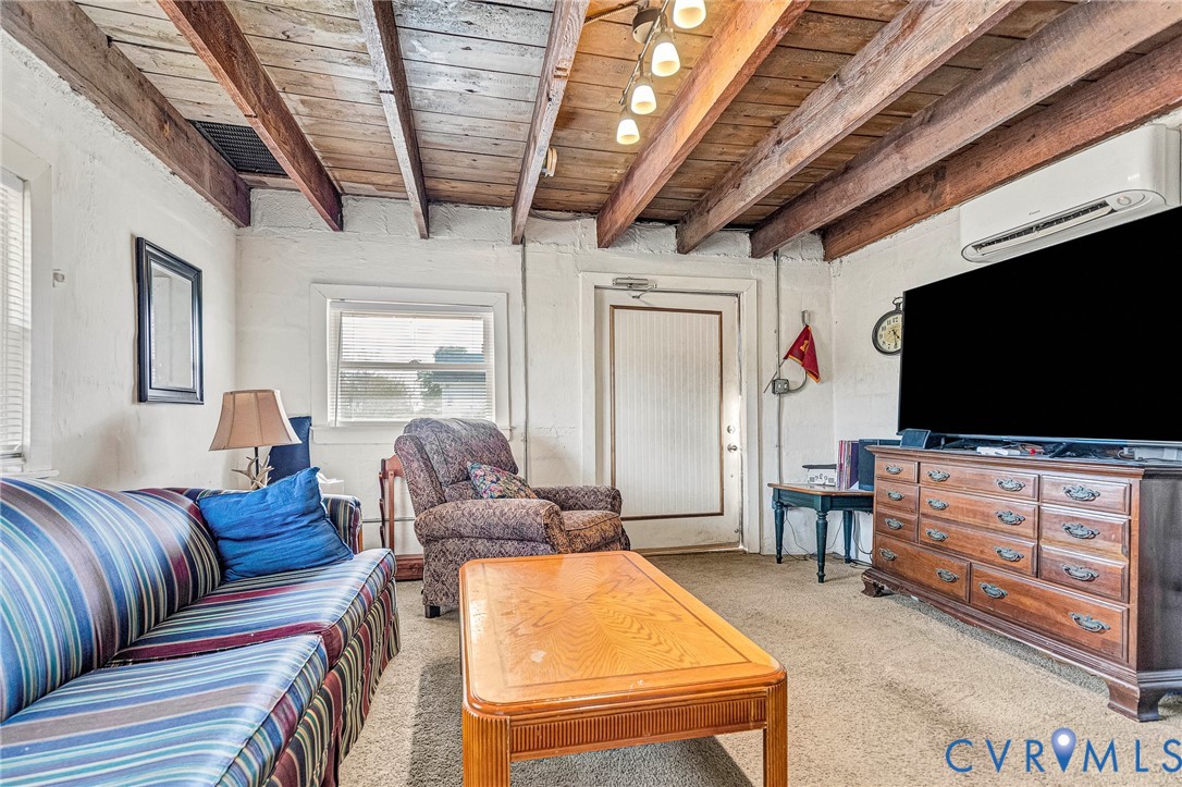 2172 Piping Tree Ferry Road Mechanicsville, VA 23111 - Photo 31 of 50 a living room with furniture and a flat screen tv