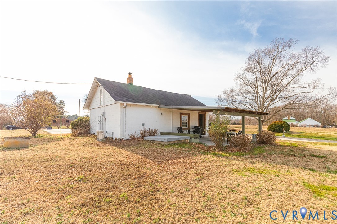 2172 Piping Tree Ferry Road Mechanicsville, VA 23111 - Photo 8 of 50 a view of a house with a yard covered in snow