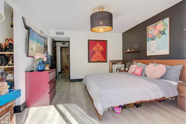 a bedroom with bed and a couch