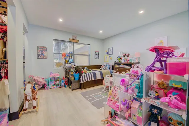 a bedroom with furniture and a gym equipment