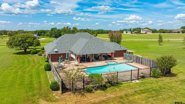 an aerial view of a house with a garden