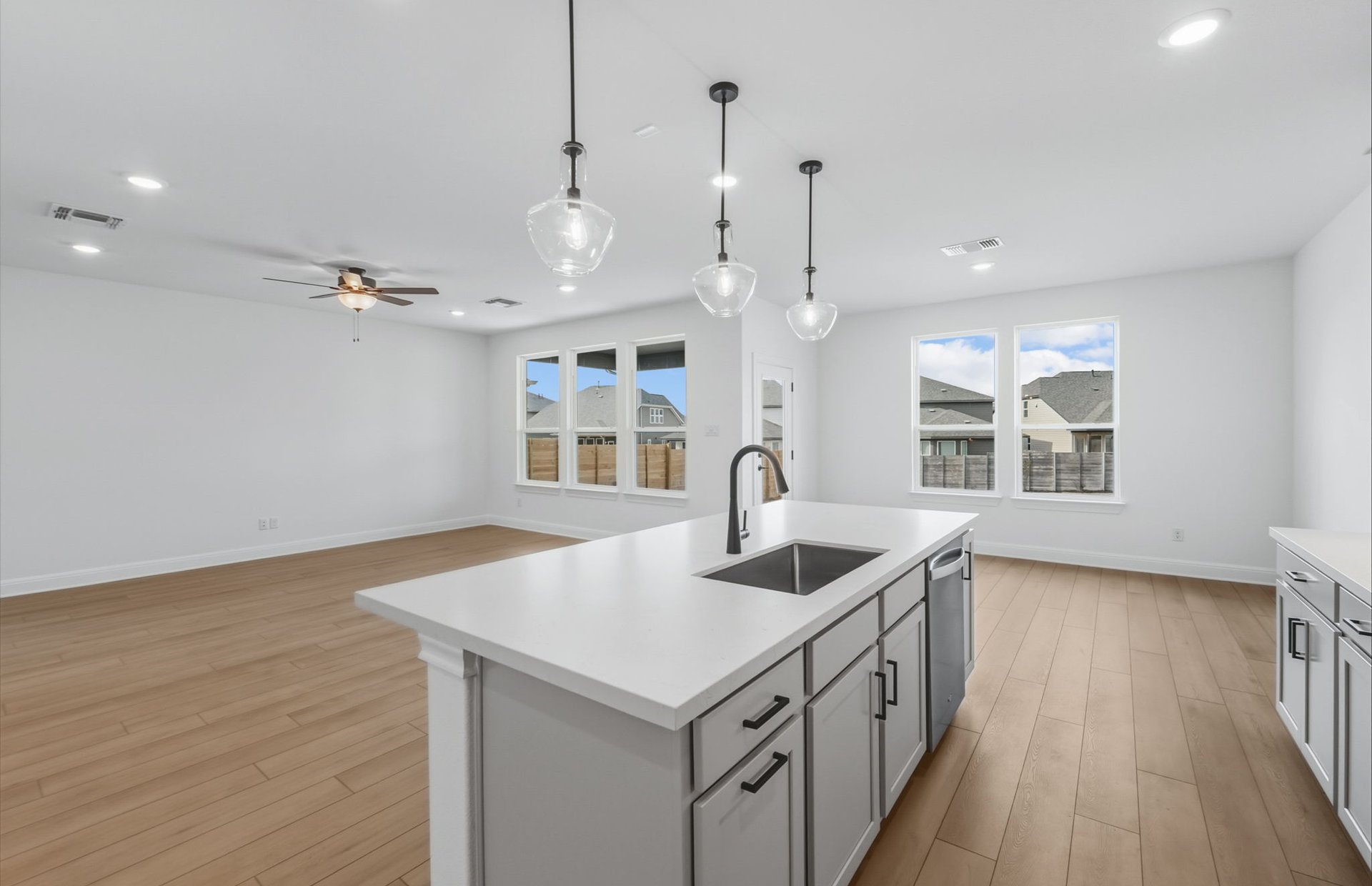 421 Foresail Road Leander, TX 78641 - Photo 10 of 28 a kitchen that has a lot of cabinets and wooden floor