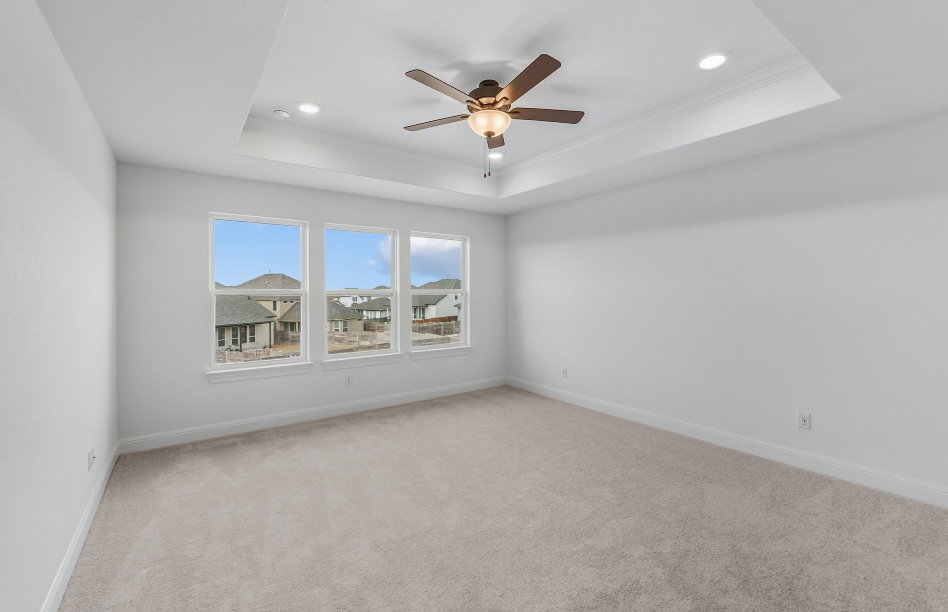 421 Foresail Road Leander, TX 78641 - Photo 12 of 28 a view of an empty room with a ceiling fan and window