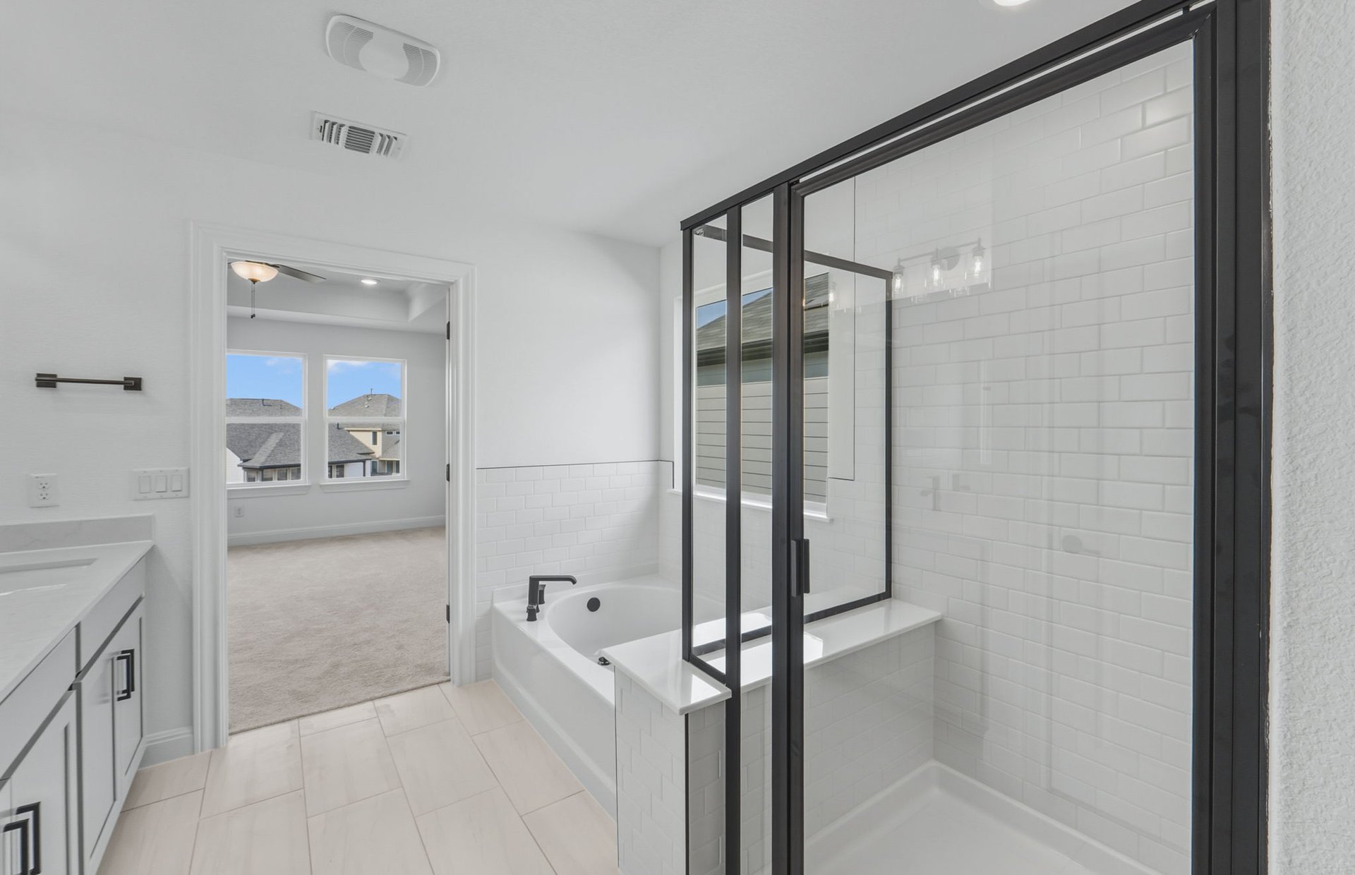 421 Foresail Road Leander, TX 78641 - Photo 16 of 28 a bathroom with a tub shower sink and mirror