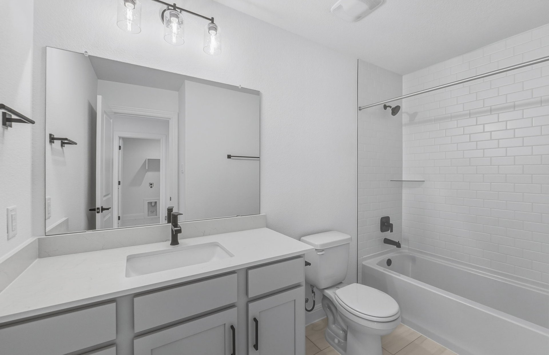 421 Foresail Road Leander, TX 78641 - Photo 21 of 28 a bathroom with a sink toilet vanity and shower