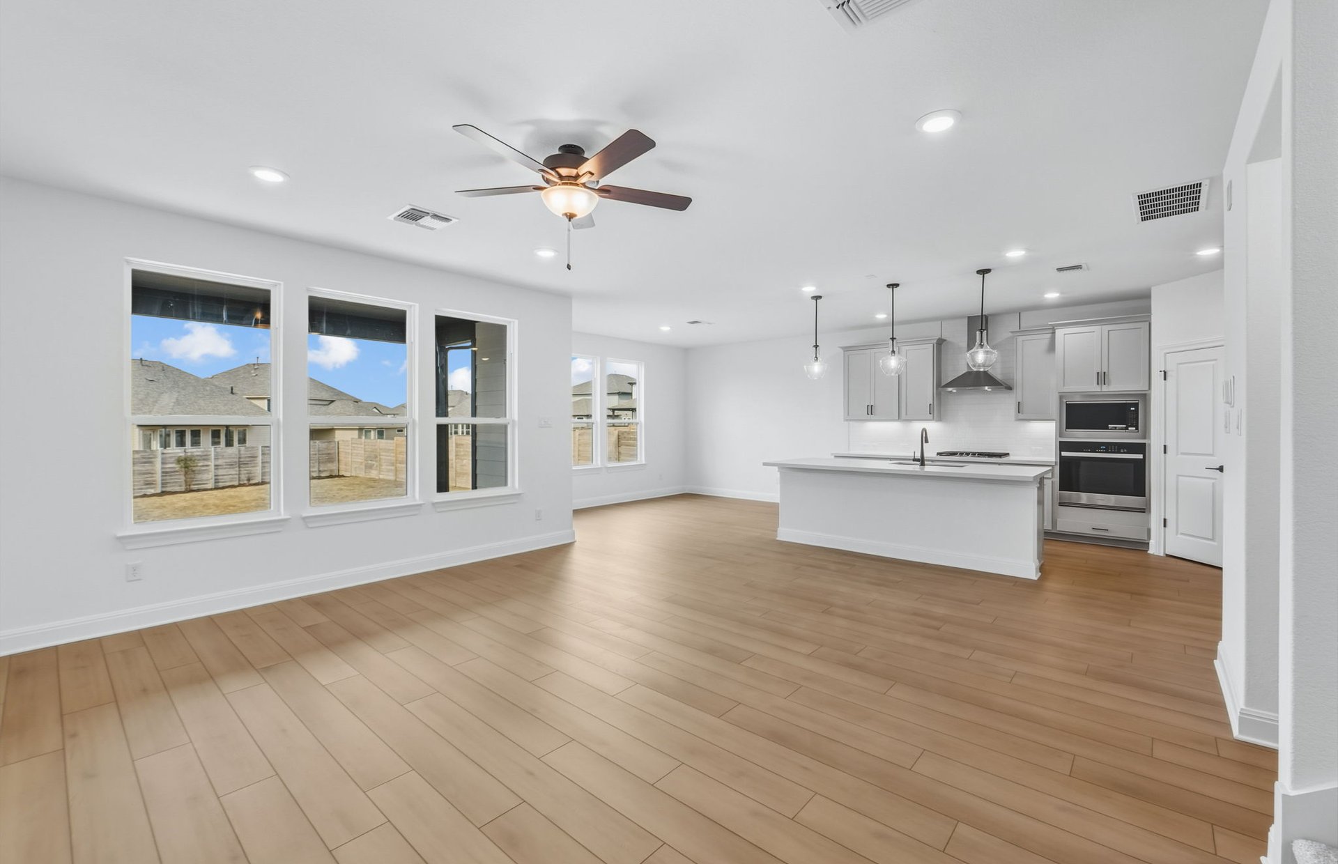 421 Foresail Road Leander, TX 78641 - Photo 4 of 28 a view of an empty room with kitchen natural appliances
