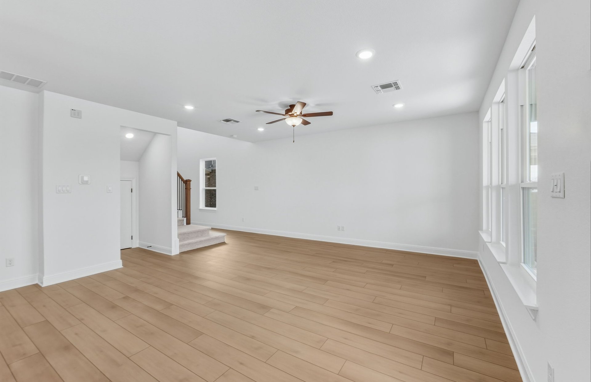 421 Foresail Road Leander, TX 78641 - Photo 6 of 28 wooden floor in an empty room with a window