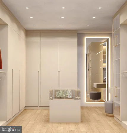 a view of a hallway with a livingroom and a hall with wooden floor